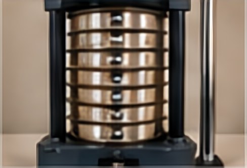Laboratory sieve shaker holding a stack of test sieves