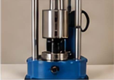 Automatic laboratory soil compactor with a blue base